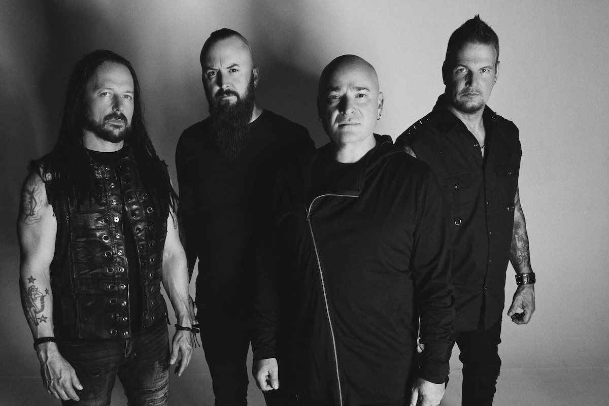 Black and white promotional portrait of heavy metal band Disturbed with lead singer David Draiman.
